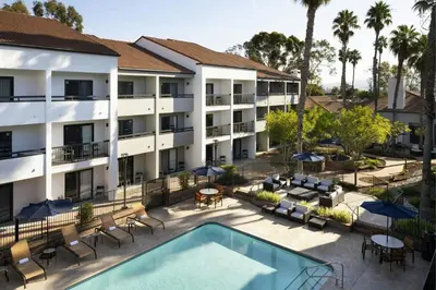 an aerial view of the courtyard of a hotel with a swimming pool at Courtyard Los Angeles Torrance/Palos Verdes in Torrance