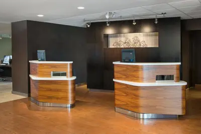 a lobby with two counters with computers on them at Courtyard Los Angeles Torrance/Palos Verdes in Torrance