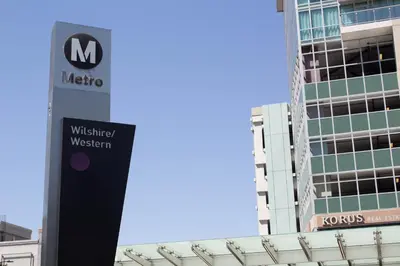 a sign for a nissan dealership in front of a building at Libra Hotel in Los Angeles
