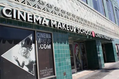 a building with a sign for a makeup school at Libra Hotel in Los Angeles