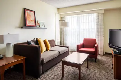 a living room with a couch and a chair at Residence Inn by Marriott Cypress Los Alamitos in Los Alamitos