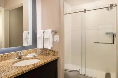 a bathroom with a sink and a shower at Residence Inn Anaheim Placentia/Fullerton in Placentia