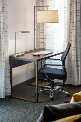 an office desk with a chair and a lamp at Residence Inn Pasadena Arcadia in Arcadia