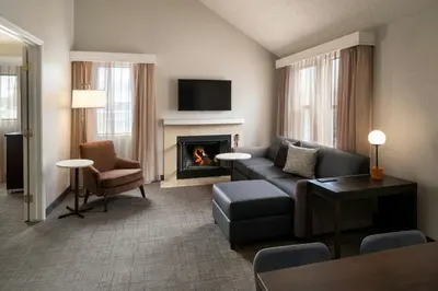 a living room with a couch and a fireplace at Residence Inn Pasadena Arcadia in Arcadia