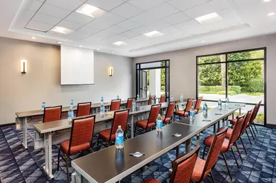 a large conference room with a long table and chairs at Courtyard by Marriott Anaheim Resort/Convention Center in Anaheim