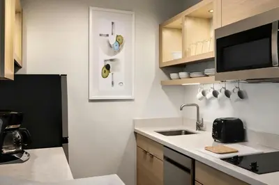 a kitchen with a sink and a counter top at TownePlace Suites by Marriott Anaheim Maingate Near Angel Stadium in Anaheim