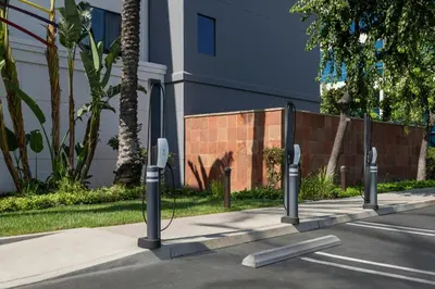 a row of parking meters on the side of a street at Courtyard Los Angeles Burbank Airport in Burbank