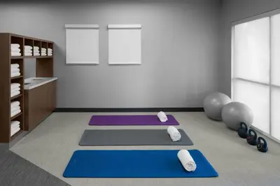 a room with three yoga mats on the floor at Courtyard Los Angeles Burbank Airport in Burbank