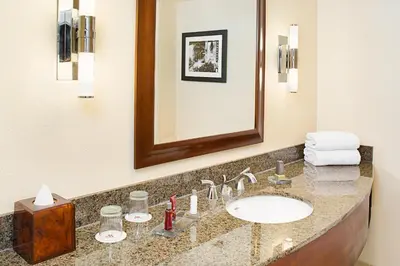 a bathroom with a sink and a mirror at Los Angeles Marriott Burbank Airport in Burbank