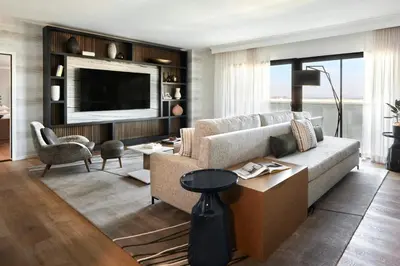 a living room with a couch and a tv at Anaheim Marriott in Anaheim