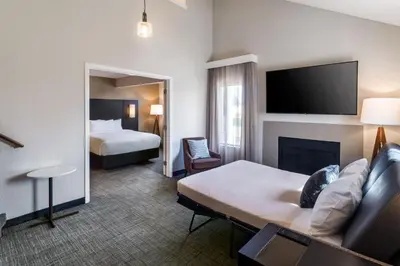 a hotel room with a bed and a tv at Residence Inn by Marriott Long Beach in Long Beach