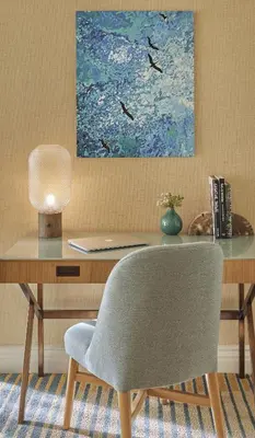 a desk with a chair and a painting on the wall at Viceroy Santa Monica in Los Angeles