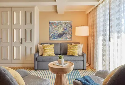 a living room with a couch and a table at Viceroy Santa Monica in Los Angeles