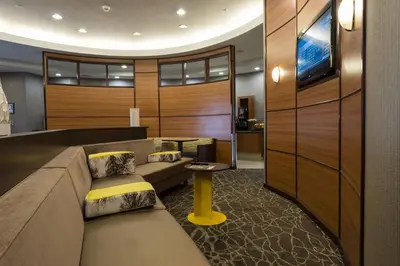 a living room with a couch and a table at SpringHill Suites Ridgecrest in Ridgecrest