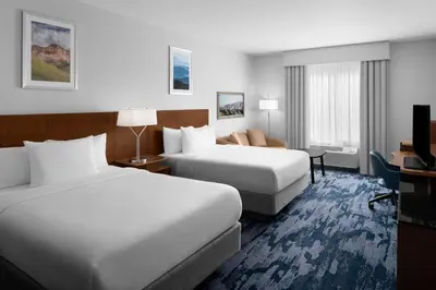 a hotel room with two beds and a desk at Fairfield Inn by Marriott Santa Clarita Valencia in Santa Clarita