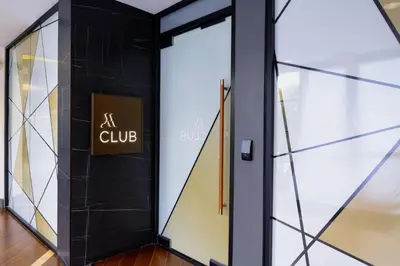 a door in a store with a sign that reads at club at Long Beach Marriott in Long Beach