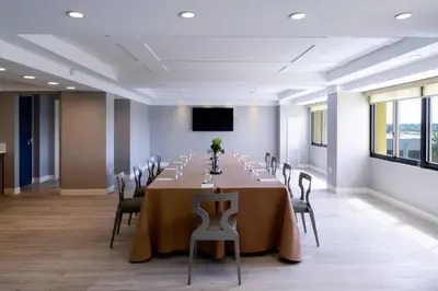 a conference room with a long table and chairs at Long Beach Marriott in Long Beach