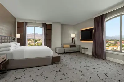 a hotel room with a bed and a television at Sheraton Los Angeles San Gabriel in San Gabriel