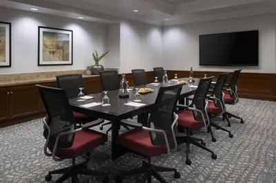 a conference room with a table and chairs at Bakersfield Marriott at the Convention Center in Bakersfield