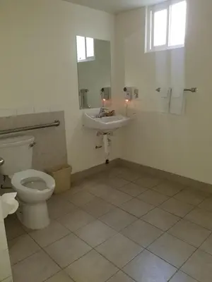 a bathroom with a toilet and a sink at Super 8 by Wyndham Los Angeles-Culver City Area in Los Angeles