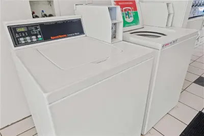 a white washing machine sitting inside of a store at Motel 6-Ventura, CA - Beach in Ventura