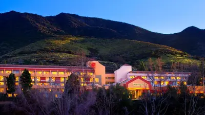a building with a mountain in the background at Sheraton Agoura Hills Hotel in Agoura Hills