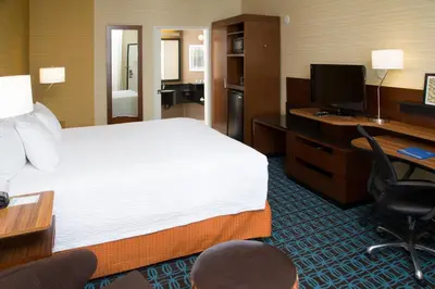 a hotel room with a bed and a desk with a computer at Fairfield Inn Anaheim Hills Orange County in Anaheim