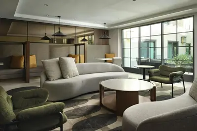 a living room with a couch and chairs and a table at Courtyard by Marriott Los Angeles Pasadena Old Town in Pasadena