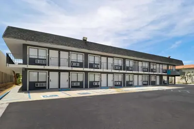 a large building with a lot of windows at Clarion Pointe Ridgecrest near China Lake Naval Station in Ridgecrest