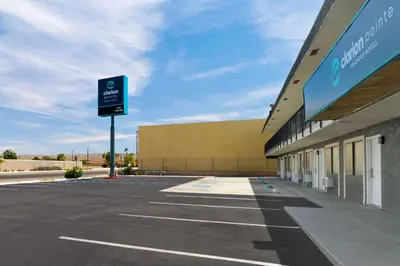an empty parking lot in front of a building at Clarion Pointe Ridgecrest near China Lake Naval Station in Ridgecrest