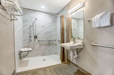 a bathroom with a shower and a sink at Motel 6-San Bernardino, CA - South in San Bernardino