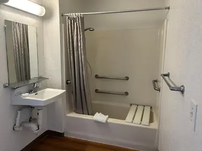 a small bathroom with a sink and a shower at Motel 6-Stanton, CA- Anaheim West in Stanton