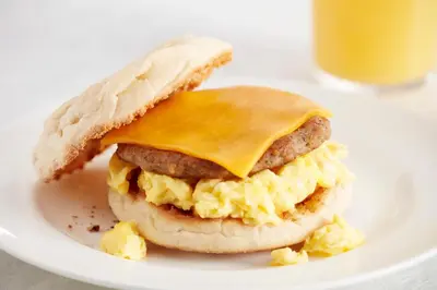a breakfast sandwich with eggs and cheese on a plate at Residence Inn by Marriott Ontario Airport in Ontario