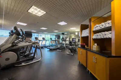 a gym with treadmills and exercise bikes in it at Anaheim Marriott Suites in Anaheim