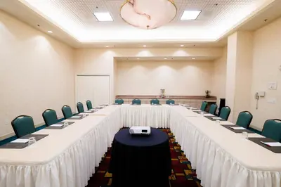 a conference room with a long table and chairs at Anaheim Marriott Suites in Anaheim