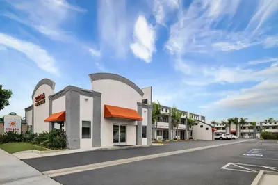 a parking lot in front of a hotel at Solara Inn and Suites in Anaheim