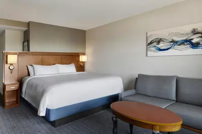 a hotel room with a bed and a couch at Courtyard Ventura Simi Valley in Simi Valley