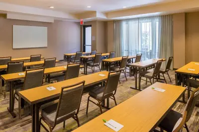 a classroom with tables and chairs and a whiteboard at Courtyard by Marriott Thousand Oaks Ventura County in Thousand Oaks