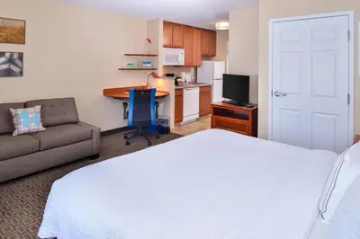 a bedroom with a bed and a couch and a desk at TownePlace Suites by Marriott Thousand Oaks Ventura County in Thousand Oaks