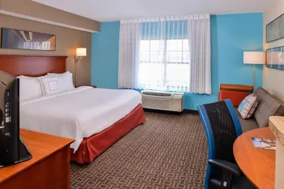 a hotel room with a bed and a television at TownePlace Suites by Marriott Thousand Oaks Ventura County in Thousand Oaks