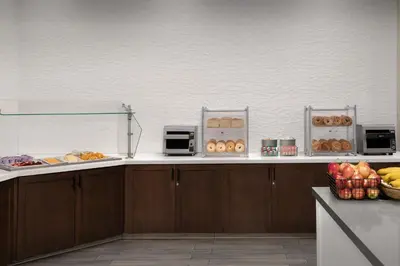 a kitchen with a counter with food on it at Residence Inn by Marriott Anaheim Resort Area/Garden Grove in Anaheim