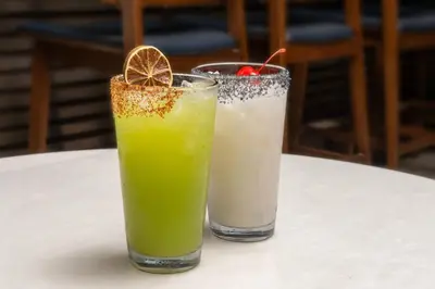 two cocktails sitting on a table with a drink at Residence Inn by Marriott Anaheim Resort Area/Garden Grove in Anaheim