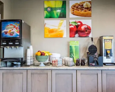 a kitchen counter with a television and fruit on it at Quality Inn Ontario Airport Convention Center in Ontario