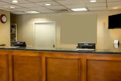 a waiting room with two computers on a counter at Quality Inn Riverside near UCR and Downtown in Riverside