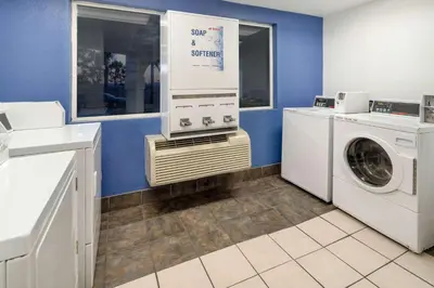 a laundry room with a washer and dryer at Motel 6-Ventura, CA - South in Ventura