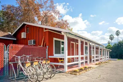 a red house with bikes parked outside of it at Ojai Rancho Inn in Ojai