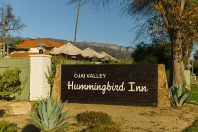 a sign for an old valley hamiminished inn at Hummingbird Inn in Ojai
