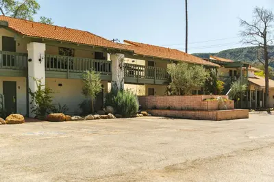 a large house with a large parking lot in front of it at Hummingbird Inn in Ojai