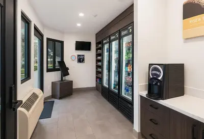 a waiting room with a drink cooler in a store at Motel 6-Westminster, CA - North in Westminster