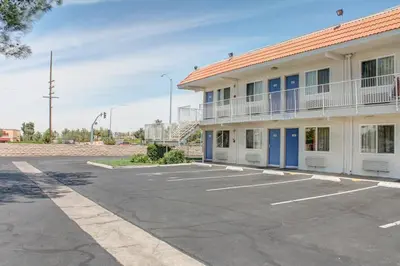 a parking lot in front of a building at Motel 6-Lancaster, CA in Lancaster